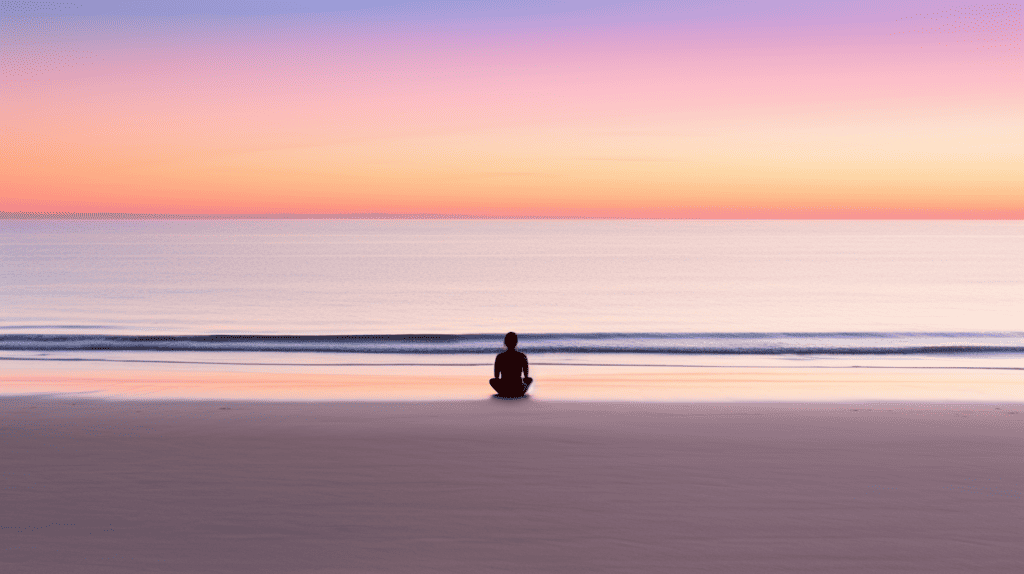 Ram Dass Guided Meditation. Person on the beach at sunset meditating.